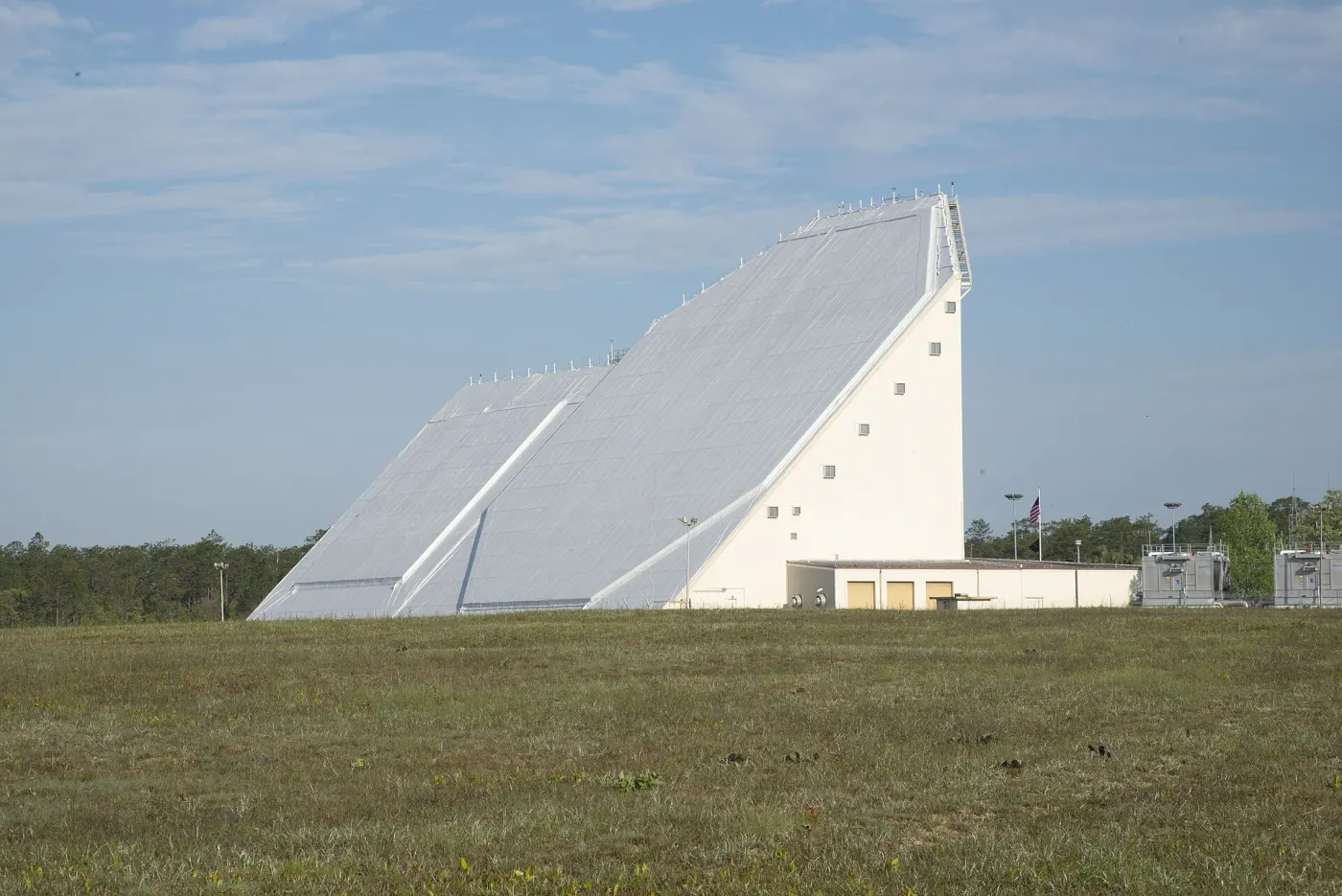 The AN/FPS-85 phased-array radar at Eglin, a sloped white building with a flat antenna face